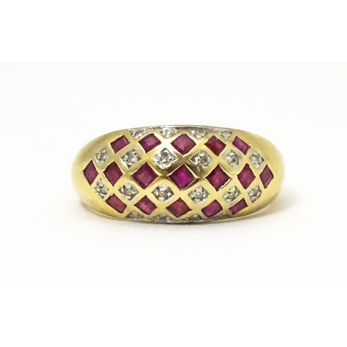 671 - A 9ct gold ring set with rubies and diamonds. Ring size approx  L 1/2