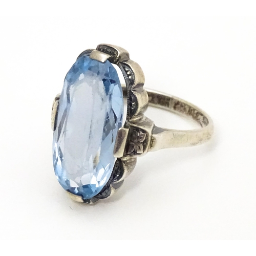 676 - A Continental .830 silver ring set with aquamarine. Ring size approx. L 1/2