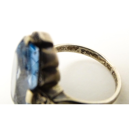 676 - A Continental .830 silver ring set with aquamarine. Ring size approx. L 1/2