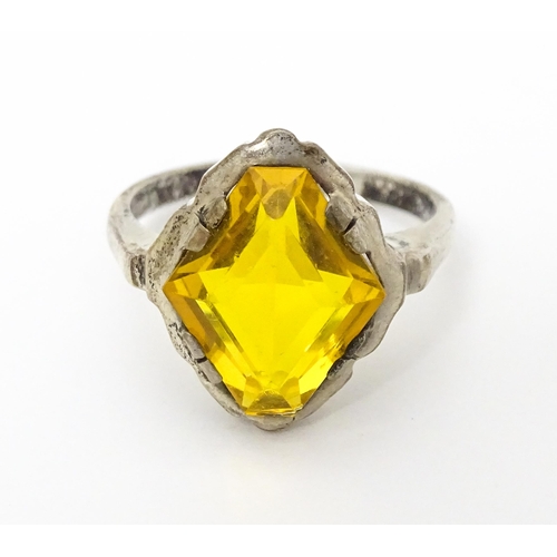 677 - A Continental .835 silver ring set with citrine. Ring size approx. O