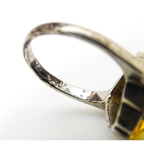 677 - A Continental .835 silver ring set with citrine. Ring size approx. O