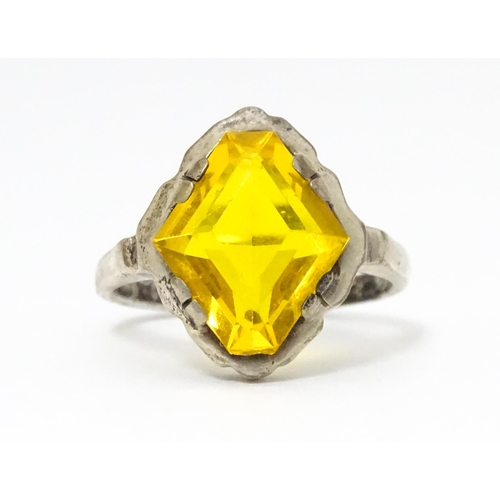 677 - A Continental .835 silver ring set with citrine. Ring size approx. O