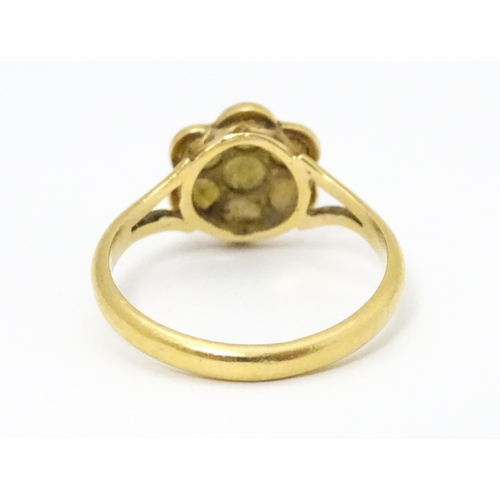 681 - A yellow metal ring set with seed pearls. Ring size approx. M 1/2