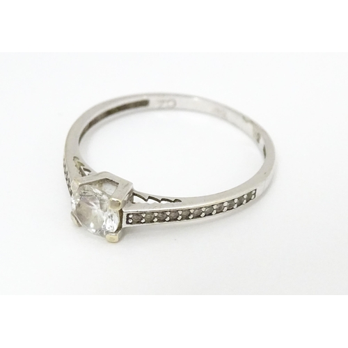 684 - A 9ct white gold ring set with cubic zirconia. Ring size approx. S