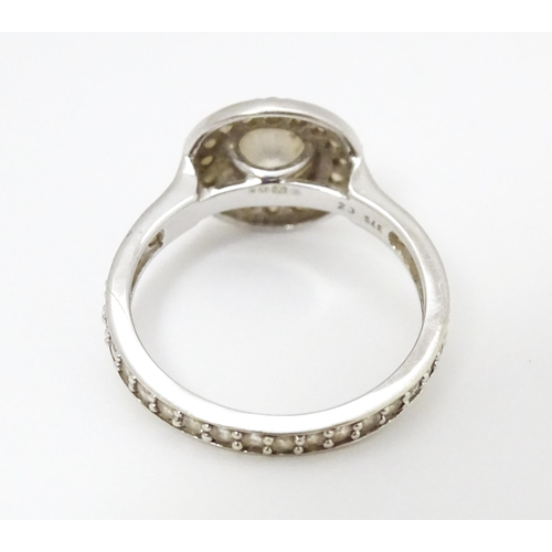 685 - A 9ct white gold ring set with cubic zirconia. Ring size approx. L 1/2