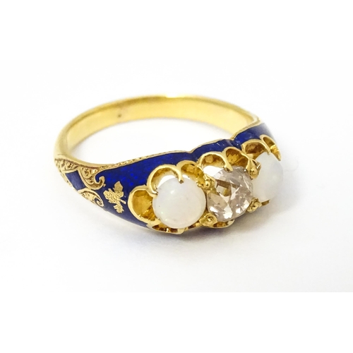 694 - A 19thC yellow gold ring set with central diamond flanked by opals in a blue enamel setting. Ring si... 