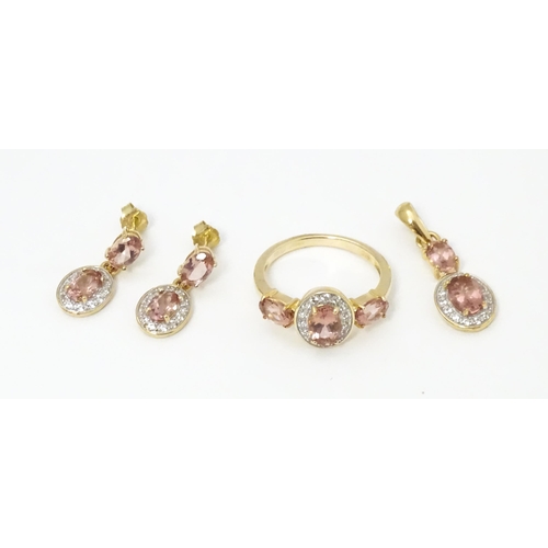 696 - A suite of jewellery comprising ring, earrings and pendant set with Rose apatite and Zircon. Ring si... 