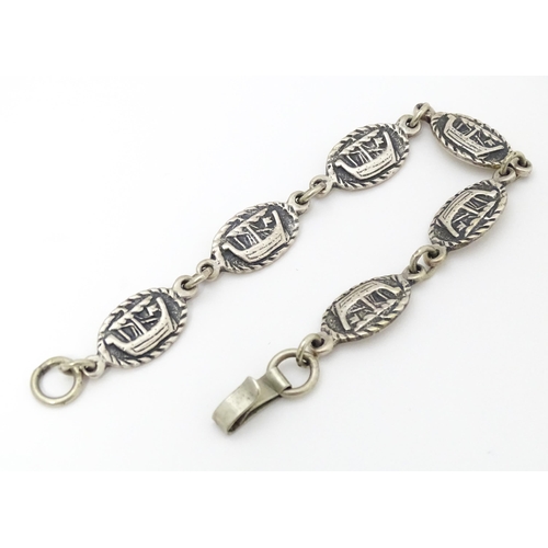 698 - Iona Silver : A silver bracelet with Viking ship decoration. Bearing marks for Iain MacCormick with ... 