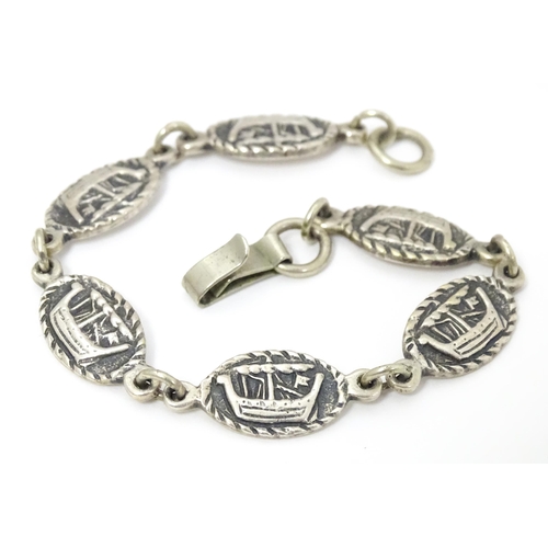 698 - Iona Silver : A silver bracelet with Viking ship decoration. Bearing marks for Iain MacCormick with ... 