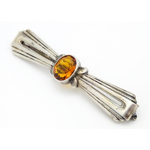 711 - A Continental .835 silver brooch set with central citrine. Indistinctly marked. 2 1/2