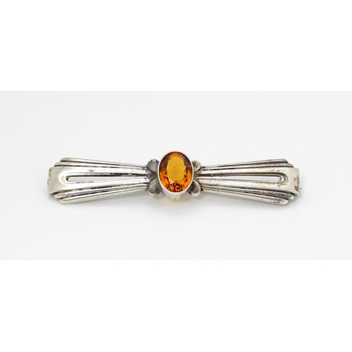 711 - A Continental .835 silver brooch set with central citrine. Indistinctly marked. 2 1/2