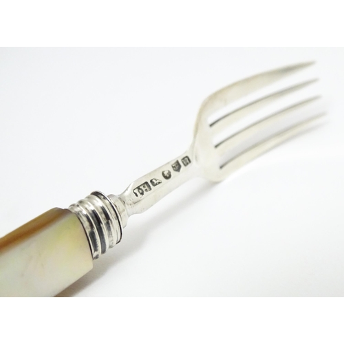 394 - A Victorian silver fork with mother of pearl handle. Hallmarked Birmingham 1844 maker John Hilliard.... 