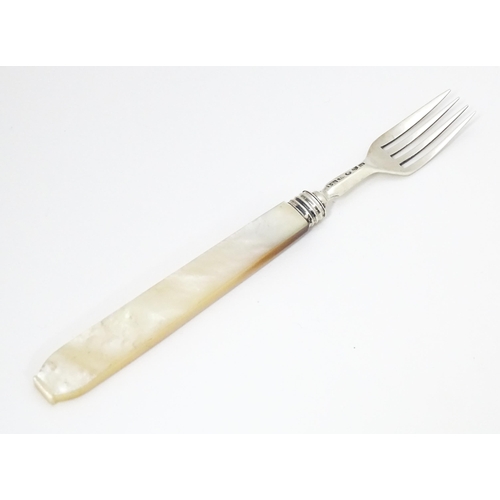 394 - A Victorian silver fork with mother of pearl handle. Hallmarked Birmingham 1844 maker John Hilliard.... 