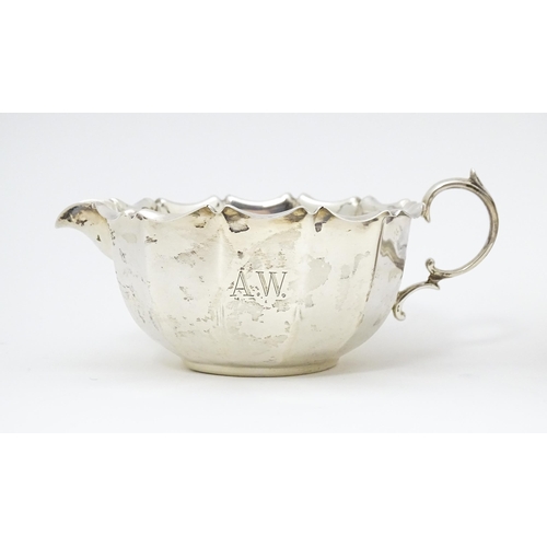 399 - A silver milk / cream jug and sugar bowl, hallmarked Sheffield 1902 & 1904 maker Fenton Brothers Ltd... 