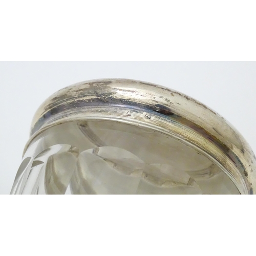 400 - A glass dressing table pot of circular form with Continental .800 silver lid. Approx. 3