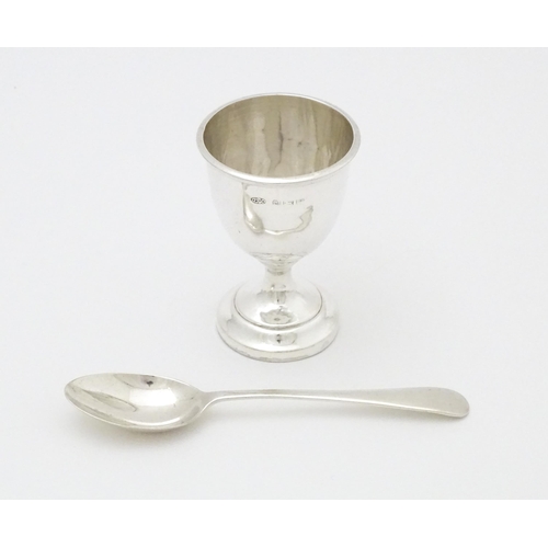 403 - A cased silver egg cup and spoon, hallmarked Birmingham 1939 maker Arthur Price & Co Ltd.