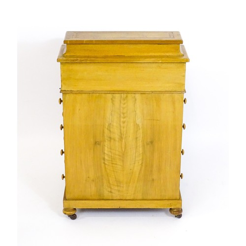 1440 - A late 19thC walnut Davenport with a fitted writing compartment to the top and an inset leather writ... 