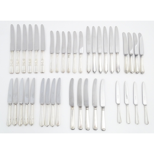 623 - A quantity of assorted silver plate flatware  / cutlery to include various knives, makers to include... 