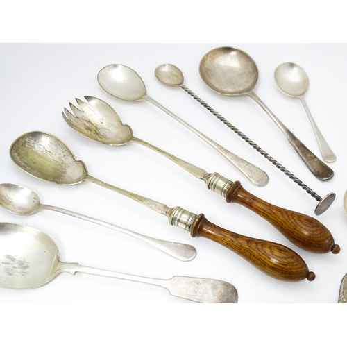 636 - A quantity of brass and silver plate ware to include various spoons, salad servers, nutcrackers to i... 