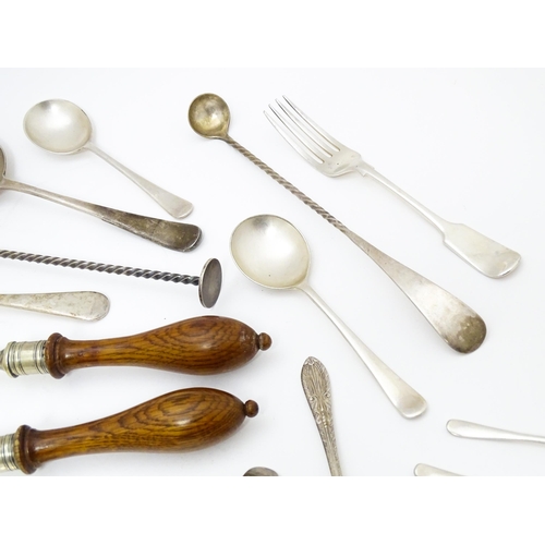 636 - A quantity of brass and silver plate ware to include various spoons, salad servers, nutcrackers to i... 