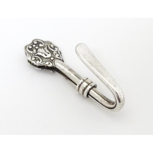 412 - A white metal napkin clip. Approx. 1 1/2