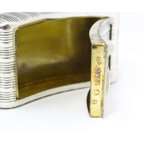 417 - A Geo III silver snuff box of shaped form with banded detail and gilded interior, hallmarked Birming... 