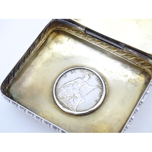 456 - A Victorian silver snuff box with Victorian coin to lid, hallmarked Birmingham 1900 maker Cornelius ... 