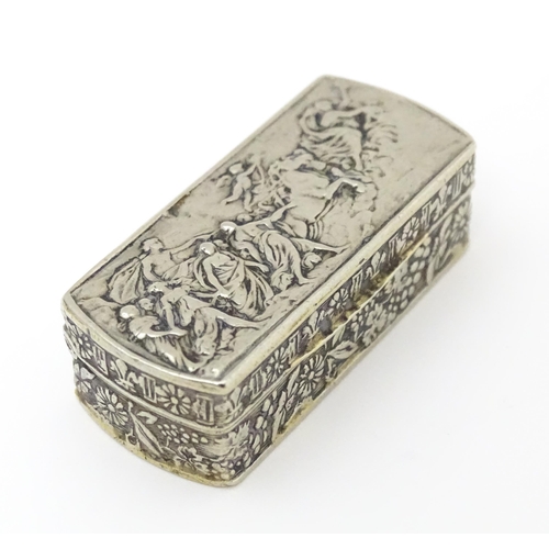 457 - An Italian white metal pill box of rectangular form with embossed decoration. Marked Italy under. Ap... 