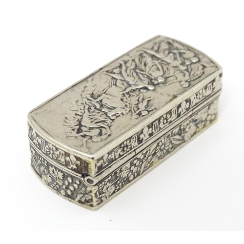 457 - An Italian white metal pill box of rectangular form with embossed decoration. Marked Italy under. Ap... 