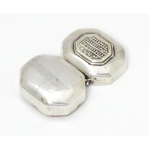 479 - A Continental white metal pill box of octagonal form with script to lid. Approx. 1