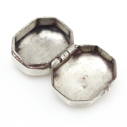 479 - A Continental white metal pill box of octagonal form with script to lid. Approx. 1