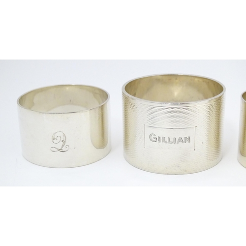 492 - Five assorted silver napkin rings to include examples hallmarked London 1937, maker S. J. Rose & Son... 