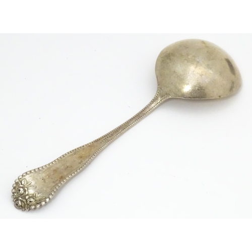 506 - Assorted silver items to include a silver handled cake knife, an American silver sauce ladle, variou... 