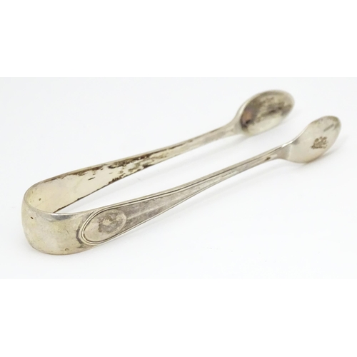 506 - Assorted silver items to include a silver handled cake knife, an American silver sauce ladle, variou... 