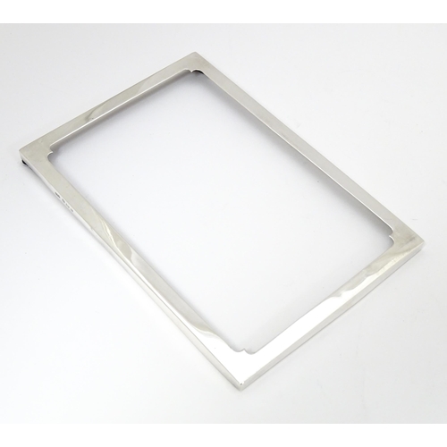 598 - A silver photograph frame surround, hallmarked Birmingham 1920 maker E F Braham Ltd (Edward Foligne ... 