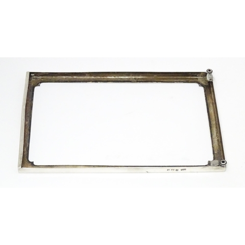 598 - A silver photograph frame surround, hallmarked Birmingham 1920 maker E F Braham Ltd (Edward Foligne ... 