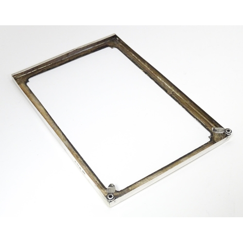 598 - A silver photograph frame surround, hallmarked Birmingham 1920 maker E F Braham Ltd (Edward Foligne ... 