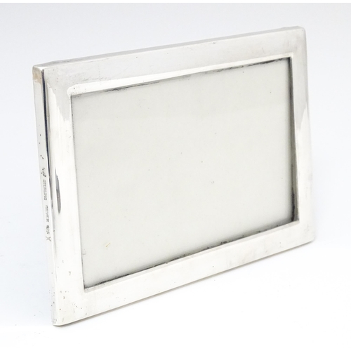 599 - A photograph frame with German .925 silver surround, marked Sterling Silver, maker Otto Wolter. Appr... 