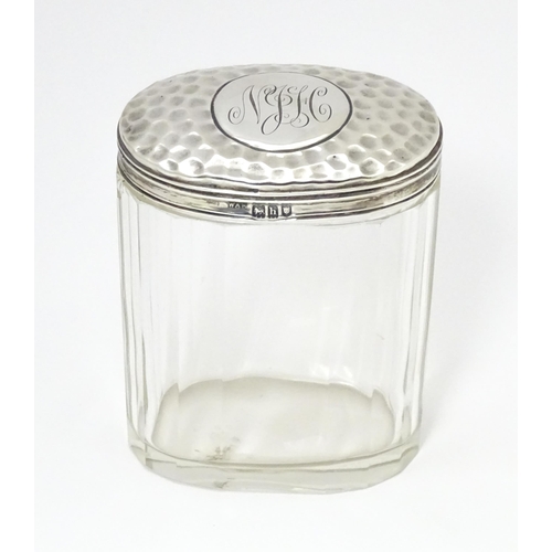 470 - A glass dressing table jar with silver lid hallmarked London 1093 maker William Amaziah Ellwick.  Ap... 