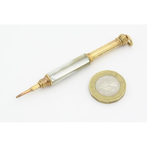 1182 - A Victorian gilt metal propelling pencil with mother of pearl detail. Marked Pearl Pat. Mar. 8 81. A... 