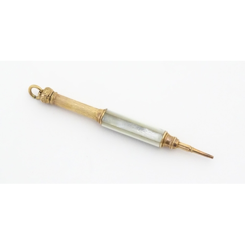 1182 - A Victorian gilt metal propelling pencil with mother of pearl detail. Marked Pearl Pat. Mar. 8 81. A... 