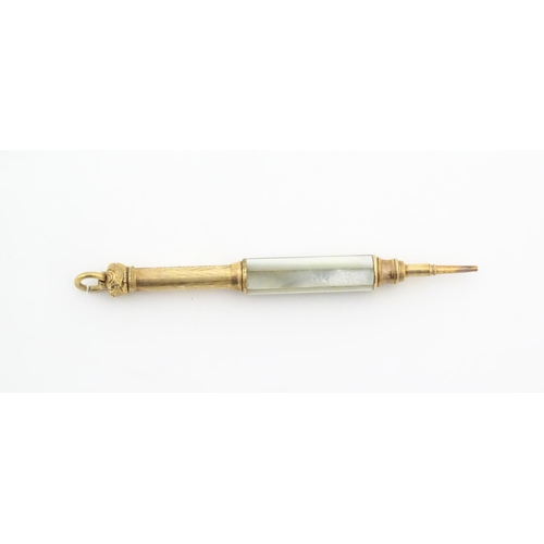 1182 - A Victorian gilt metal propelling pencil with mother of pearl detail. Marked Pearl Pat. Mar. 8 81. A... 