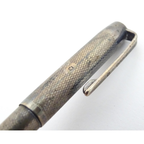 1186 - A silver Yard o' Led propelling pencil (hallmarked London 1945 maker Johnson, Matthey & Co) together... 