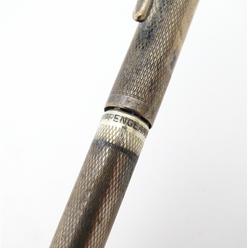 1186 - A silver Yard o' Led propelling pencil (hallmarked London 1945 maker Johnson, Matthey & Co) together... 