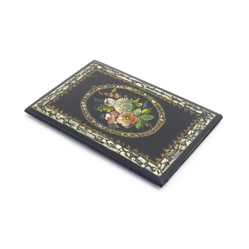 1194 - A Victorian lacquered papier mache desk blotter with hand painted floral decoration and inlaid abalo... 