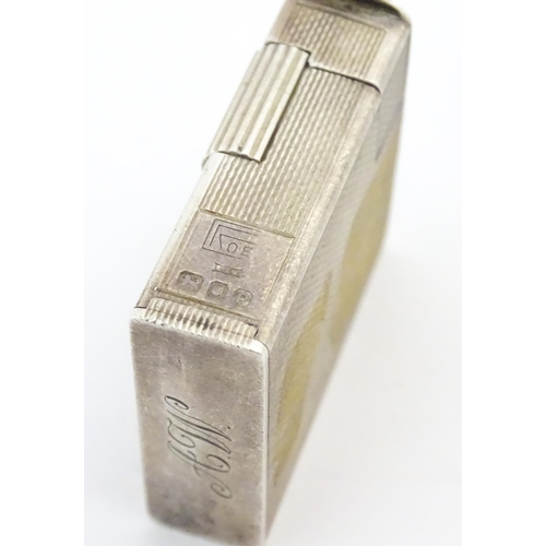 1197 - A cased Art Deco style silver pocket lighter with engine turned decoration, hallmarked 1950 London M... 