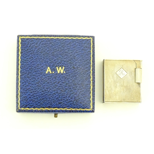 1197 - A cased Art Deco style silver pocket lighter with engine turned decoration, hallmarked 1950 London M... 