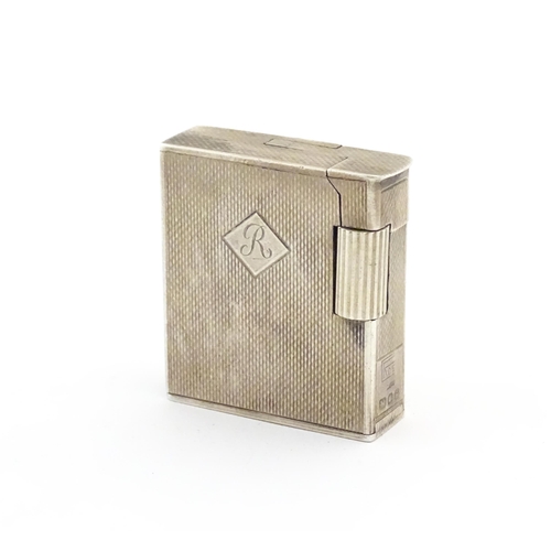 1197 - A cased Art Deco style silver pocket lighter with engine turned decoration, hallmarked 1950 London M... 