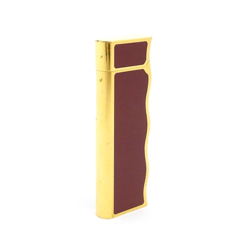 1198 - A late 20thC gold plated pocket lighter by Van Cleef & Arpels with burgundy enamel detail, stamped u... 