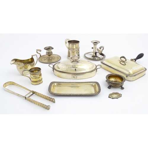 635 - A quantity of Old Sheffield Plate and silver plated wares to include chamber sticks, tankards, cream... 